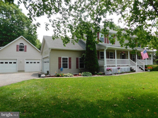 215 Cedar Beach Dr, Prince Frederick, MD 20678 - colonial house featuring covered porch, a garage, and a front lawn