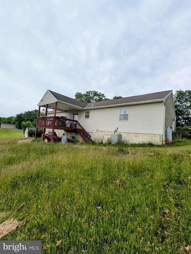 9933 Hoovers Hill Rd, Huntingdon, PA 16652 - view of side of home featuring a deck and a central AC unit