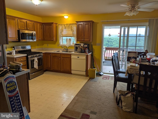 9933 Hoovers Hill Rd, Huntingdon, PA 16652 - kitchen with appliances with stainless steel finishes, a ceiling fan, light countertops, and brown cabinetry
