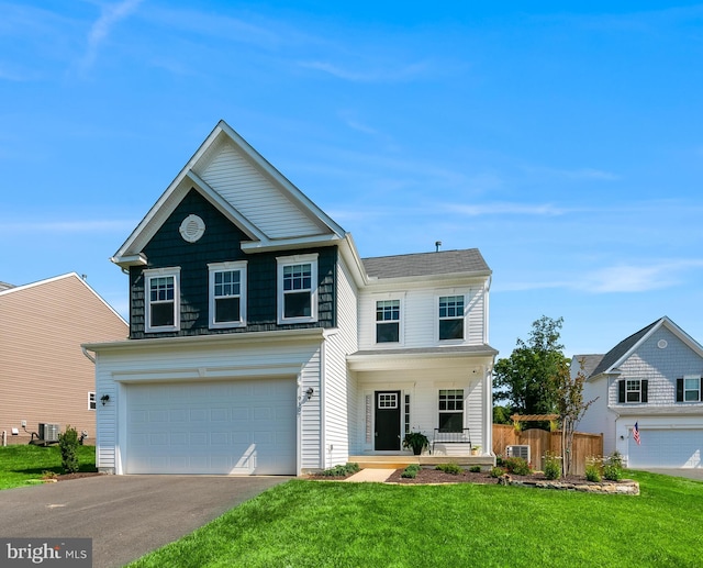 9307 Cedar Forest Dr, Fredericksburg, VA 22408 - view of front facade with a garage, driveway, and a porch