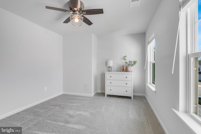 9307 Cedar Forest Dr, Fredericksburg, VA 22408 - bedroom with multiple windows, light carpet, and ceiling fan
