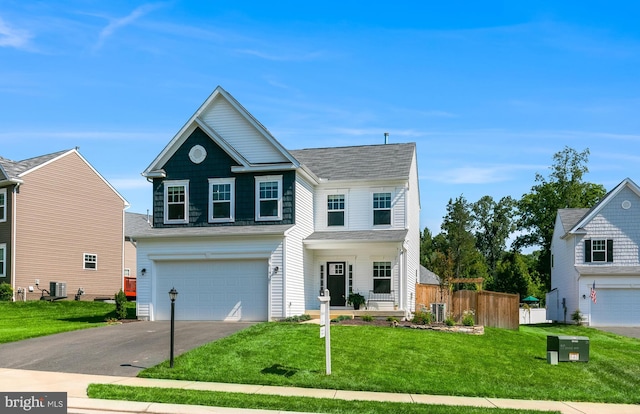 9307 Cedar Forest Dr, Fredericksburg, VA 22408 - traditional-style home with an attached garage, driveway, and roof with shingles