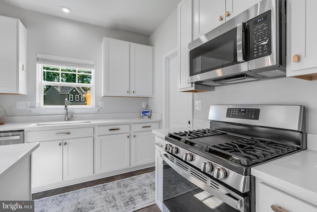 9307 Cedar Forest Dr, Fredericksburg, VA 22408 - kitchen with stainless steel appliances, white cabinets, light countertops, and recessed lighting