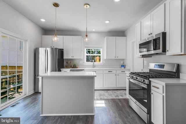 9307 Cedar Forest Dr, Fredericksburg, VA 22408 - kitchen featuring stainless steel appliances, dark wood-style floors, light countertops, white cabinets, and recessed lighting