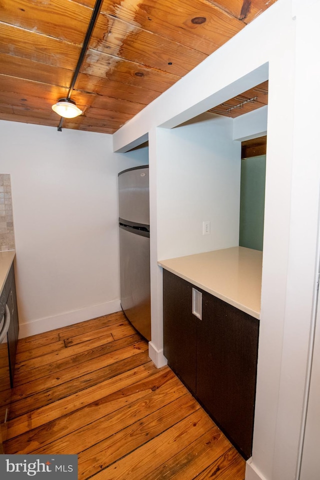309 Arch St Unit 301, Philadelphia, PA 19106 - kitchen featuring freestanding refrigerator, wooden ceiling, light wood finished floors, baseboards, and light countertops