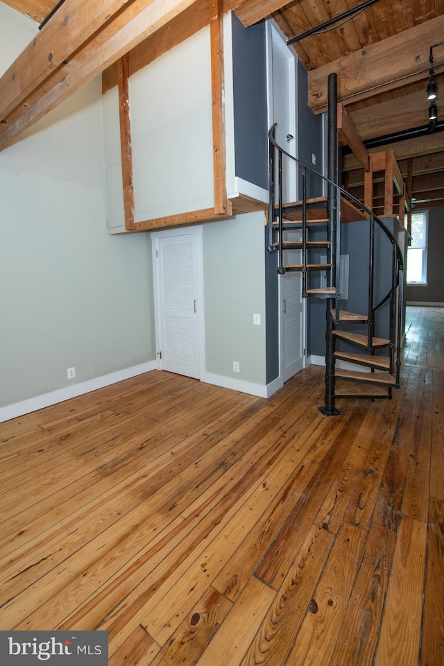 309 Arch St Unit 301, Philadelphia, PA 19106 - below grade area featuring hardwood / wood-style floors, baseboards, stairs, and wood ceiling