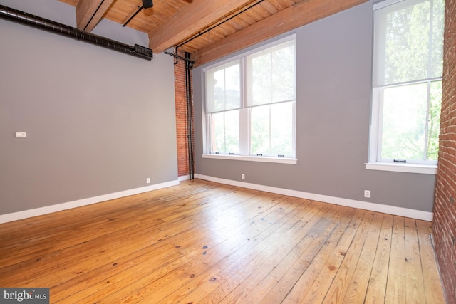 309 Arch St Unit 301, Philadelphia, PA 19106 - unfurnished room featuring wood ceiling with exposed beams, light wood finished floors, and baseboards