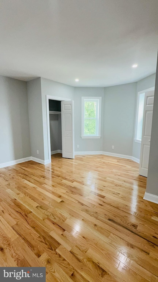 56 E Tulpehocken St, Philadelphia, PA 19144 - unfurnished bedroom featuring light wood-style flooring, a closet, baseboards, and recessed lighting