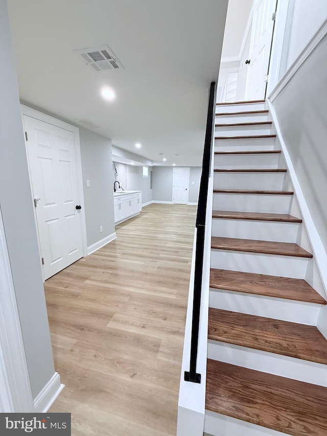 56 E Tulpehocken St, Philadelphia, PA 19144 - staircase featuring wood finished floors, baseboards, and recessed lighting