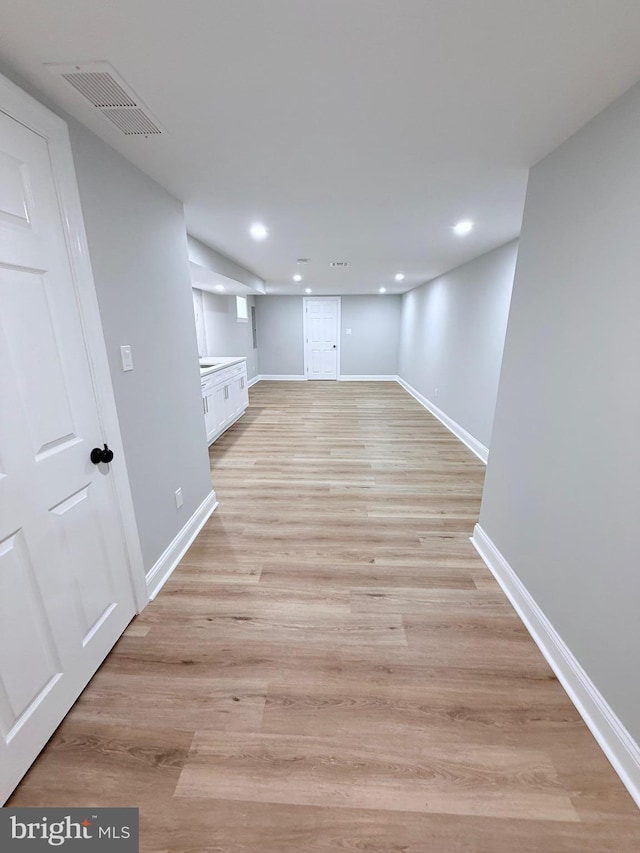 56 E Tulpehocken St, Philadelphia, PA 19144 - finished below grade area featuring baseboards, recessed lighting, and light wood-style floors