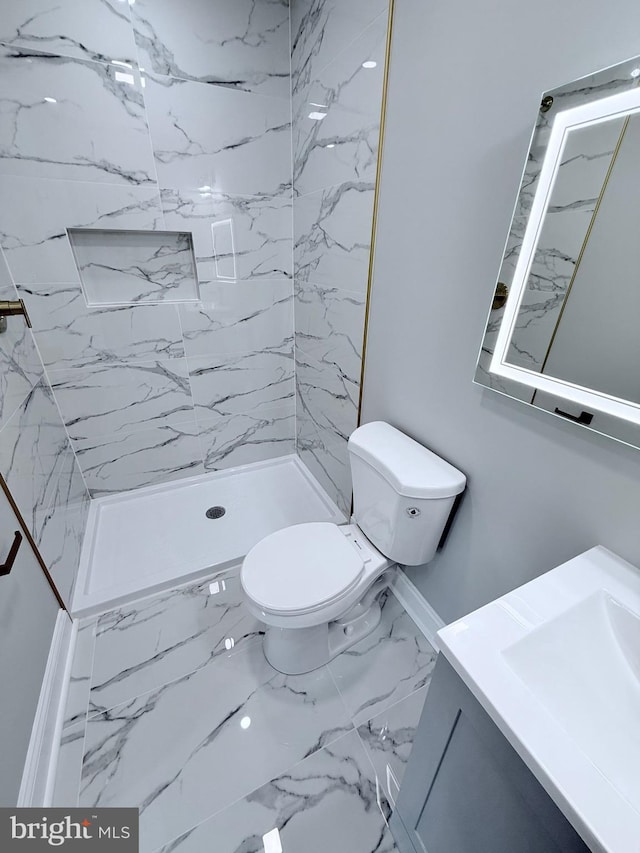 56 E Tulpehocken St, Philadelphia, PA 19144 - full bath with marble look tiles, vanity, toilet, and a stall shower