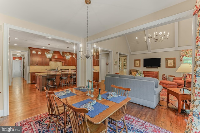 217 Valley Ridge Rd, Haverford, PA 19041 - dining area featuring a chandelier, light wood-style floors, vaulted ceiling, and recessed lighting