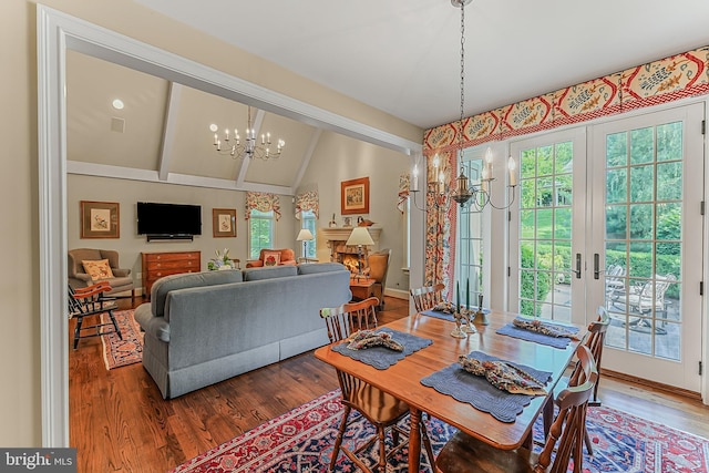 217 Valley Ridge Rd, Haverford, PA 19041 - dining area featuring healthy amount of natural light, a chandelier, wood finished floors, lofted ceiling, and french doors