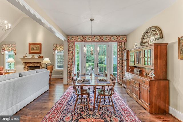 217 Valley Ridge Rd, Haverford, PA 19041 - dining space with healthy amount of natural light, wood finished floors, and a fireplace