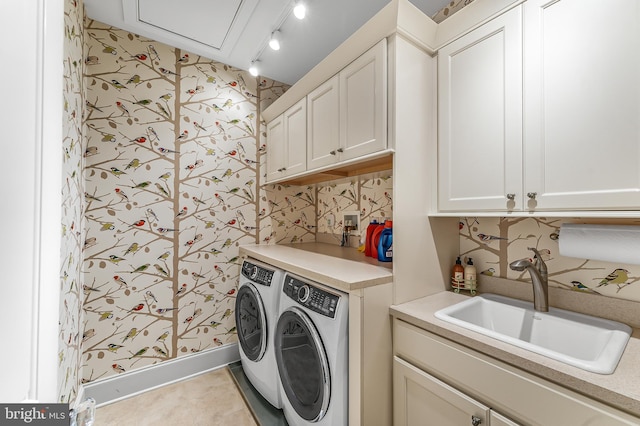 217 Valley Ridge Rd, Haverford, PA 19041 - laundry area featuring washing machine and clothes dryer, cabinet space, wallpapered walls, and tile patterned floors