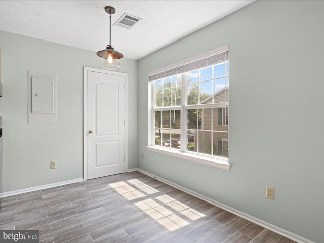 4514 Running Deer Way Unit 390A, Bowie, MD 20720 - unfurnished dining area with electric panel and wood finished floors