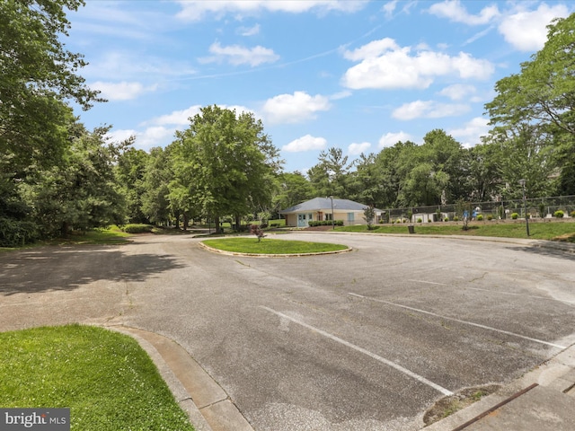 4514 Running Deer Way Unit 390A, Bowie, MD 20720 - view of asphalt street featuring curbs and view of wooded area