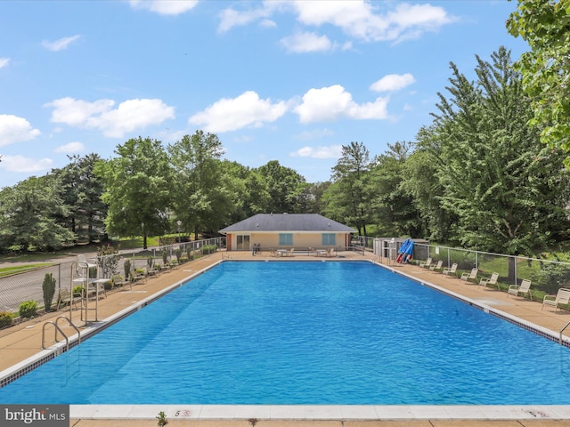 4514 Running Deer Way Unit 390A, Bowie, MD 20720 - community pool with a patio area and view of scattered trees
