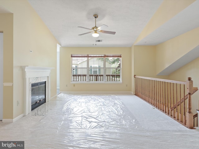 4514 Running Deer Way Unit 390A, Bowie, MD 20720 - unfurnished living room with a ceiling fan, carpet flooring, and a fireplace