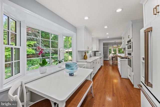 9017 Rouen Ln, Potomac, MD 20854 - dining space with healthy amount of natural light, wood finished floors, and recessed lighting