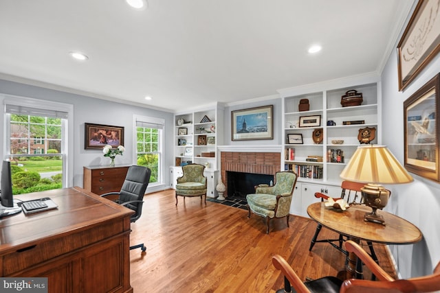 9017 Rouen Ln, Potomac, MD 20854 - office space featuring a fireplace, light wood-style flooring, ornamental molding, recessed lighting, and built in features