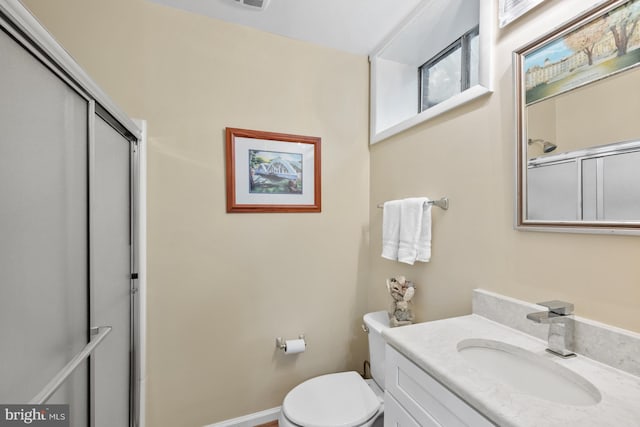 9017 Rouen Ln, Potomac, MD 20854 - bathroom featuring toilet, vanity, and a shower with door