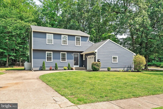 2 Tall Timber Ln, Burlington, NJ 08016 - colonial-style house featuring a garage, driveway, a front yard, and view of wooded area