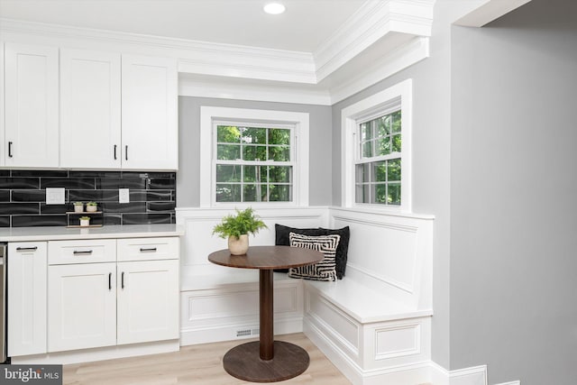 2 Tall Timber Ln, Burlington, NJ 08016 - kitchen with breakfast area, crown molding, white cabinetry, light wood-style flooring, and light countertops