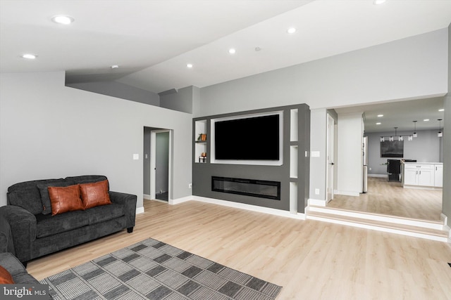 2 Tall Timber Ln, Burlington, NJ 08016 - living room featuring light wood finished floors, a glass covered fireplace, recessed lighting, and lofted ceiling