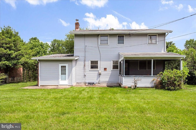 107 Pike Creek Rd, Newark, DE 19711 - back of house featuring a chimney, a yard, and a sunroom