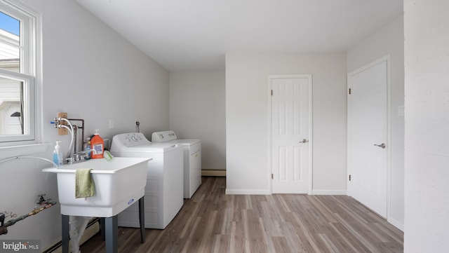 17 Rosemore Dr, Chalfont, PA 18914 - laundry room with separate washer and dryer, wood finished floors, and a baseboard radiator