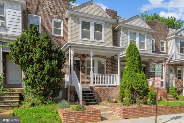 1712 W 14th St, Wilmington, DE 19806 - multi unit property featuring a porch, brick siding, and stairs