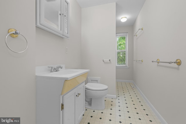 1712 W 14th St, Wilmington, DE 19806 - bathroom with vanity, toilet, and baseboards