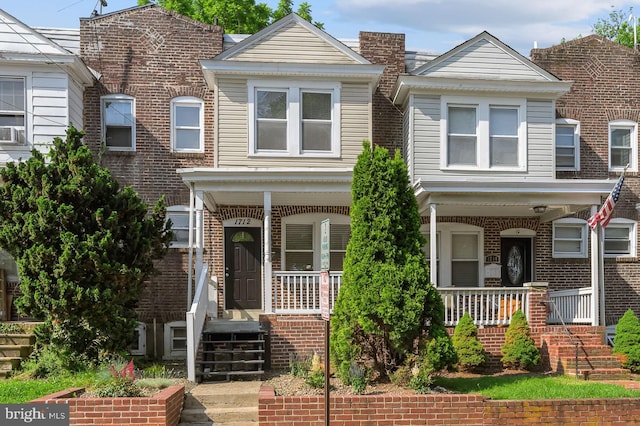 1712 W 14th St, Wilmington, DE 19806 - townhome / multi-family property featuring covered porch and brick siding