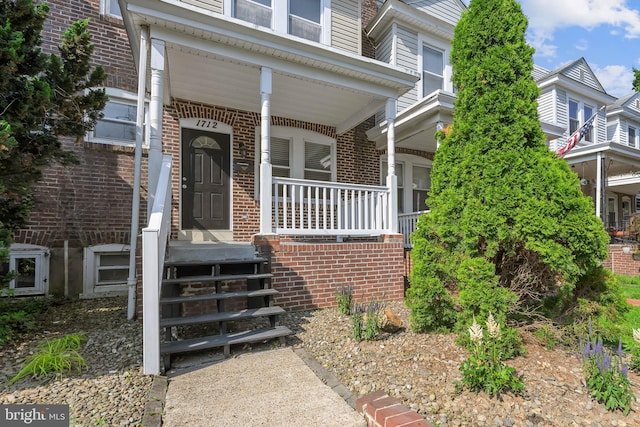 1712 W 14th St, Wilmington, DE 19806 - view of exterior entry with a porch and brick siding