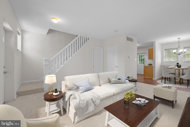1712 W 14th St, Wilmington, DE 19806 - living area with stairway, a chandelier, and baseboards