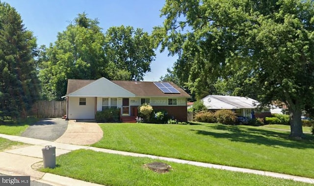4308 Independence St, Rockville, MD 20853 - view of front of house featuring driveway and roof mounted solar panels