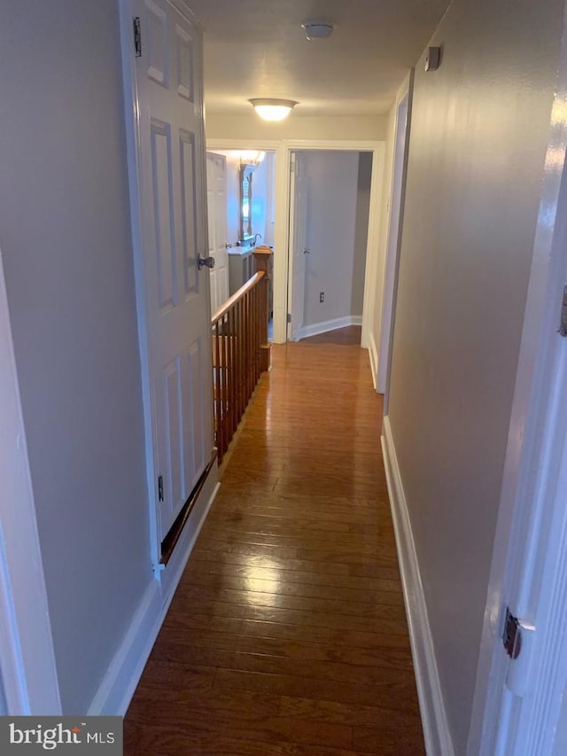 439 Prospect St, Bridgeport, PA 19405 - hallway with dark wood-style floors and baseboards