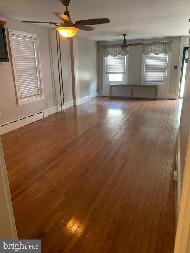 439 Prospect St, Bridgeport, PA 19405 - spare room with ceiling fan, a baseboard heating unit, radiator, and hardwood / wood-style flooring