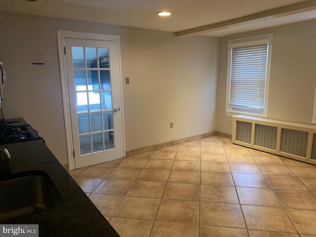 439 Prospect St, Bridgeport, PA 19405 - doorway to outside featuring radiator heating unit, light tile patterned floors, and recessed lighting