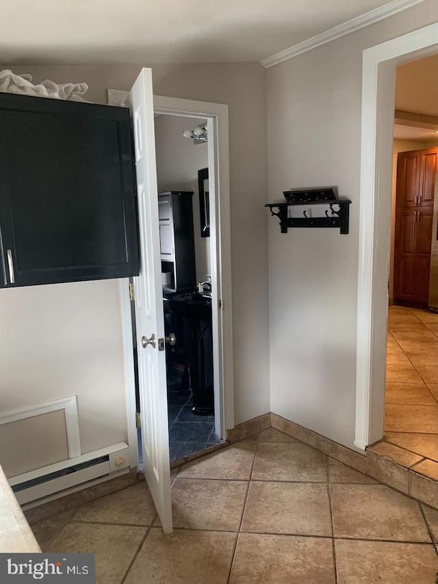 439 Prospect St, Bridgeport, PA 19405 - hallway featuring crown molding, light tile patterned floors, and a baseboard heating unit