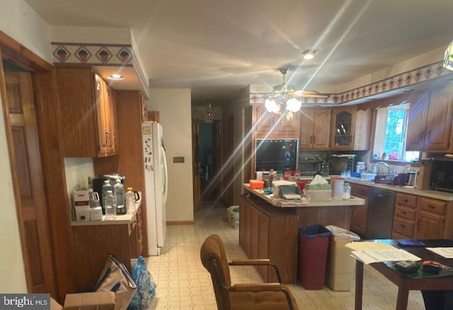 1701 Underwood Rd, Sykesville, MD 21784 - kitchen featuring freestanding refrigerator, a ceiling fan, a kitchen island, brown cabinets, and black microwave
