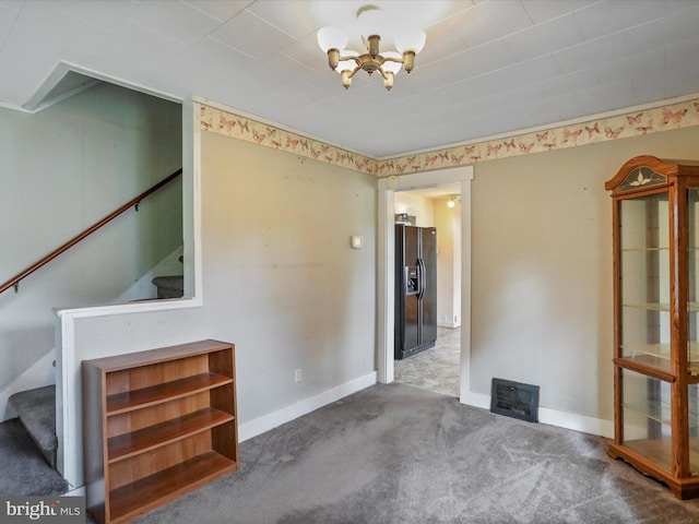 12225 Upper Georges Creek Rd SW, Frostburg, MD 21532 - carpeted spare room with stairs and a chandelier