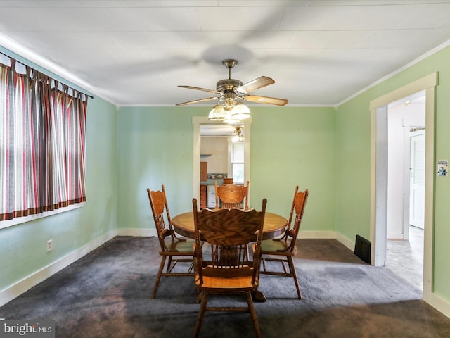 12225 Upper Georges Creek Rd SW, Frostburg, MD 21532 - dining area featuring dark colored carpet, ceiling fan, and ornamental molding