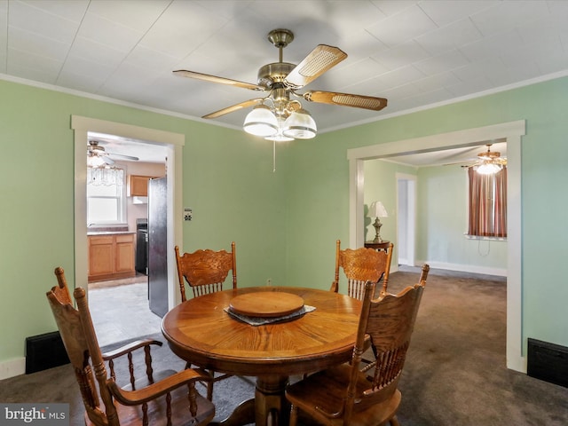 12225 Upper Georges Creek Rd SW, Frostburg, MD 21532 - carpeted dining area with ornamental molding and ceiling fan