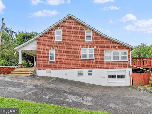 12225 Upper Georges Creek Rd SW, Frostburg, MD 21532 - view of side of home featuring brick siding, an attached garage, and driveway