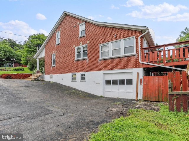 12225 Upper Georges Creek Rd SW, Frostburg, MD 21532 - view of side of home featuring an attached garage, brick siding, and driveway