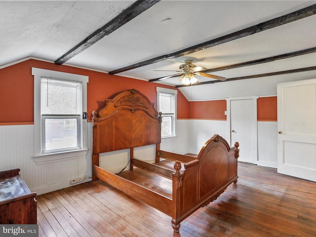 12225 Upper Georges Creek Rd SW, Frostburg, MD 21532 - bedroom featuring a wainscoted wall, hardwood / wood-style flooring, and a ceiling fan