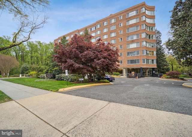 4200 Cathedral Ave NW Unit 918, Washington, DC 20016 - view of apartment building / complex featuring uncovered parking