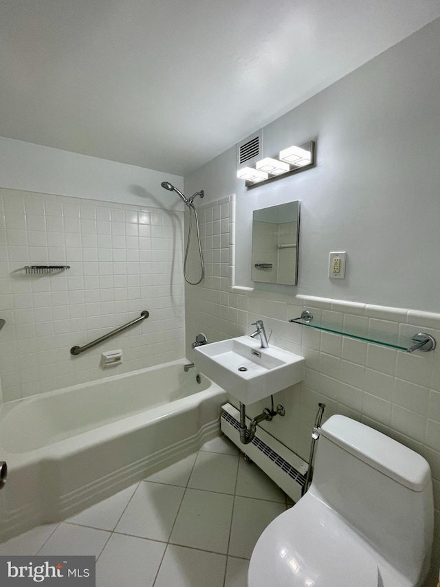 4200 Cathedral Ave NW Unit 918, Washington, DC 20016 - bathroom with a baseboard radiator, toilet, bathtub / shower combination, tile walls, and tile patterned flooring